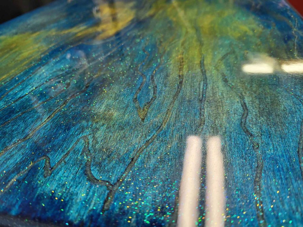 Wood with blue and yellow marbled paint job