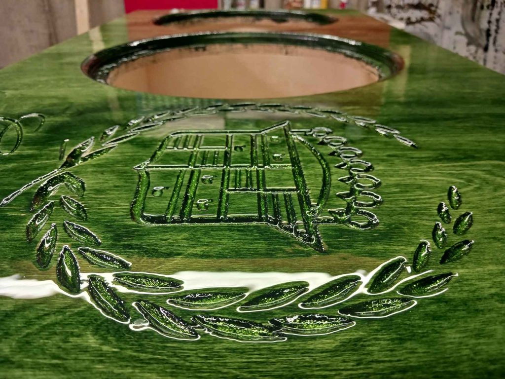 Close-up of car audio with crest engraved