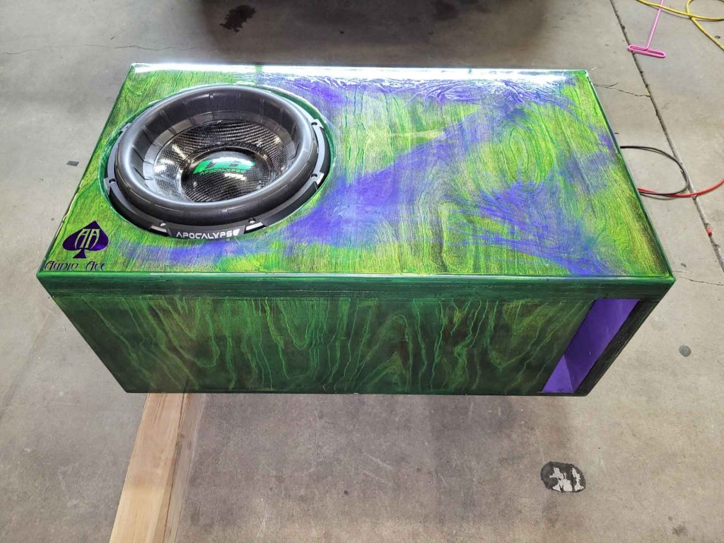 Car speaker with blue and purple marbled paint job