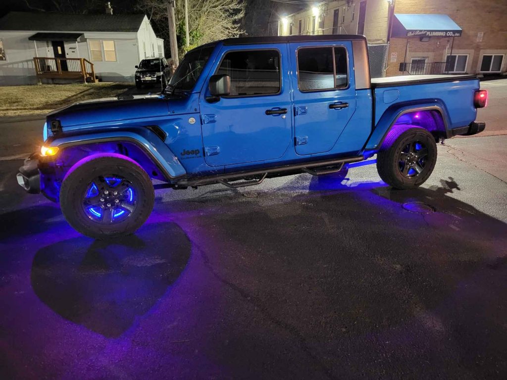 Blue Jeep Mojave with purple custom lighting