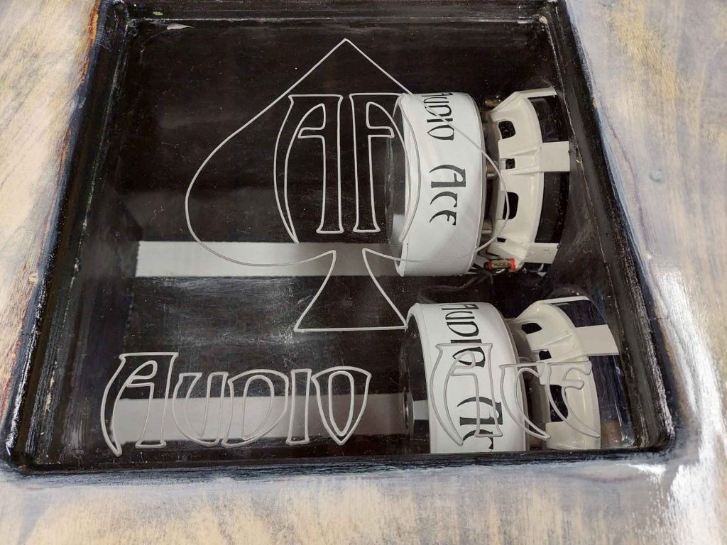 Car speaker with Audio Ace logo on it