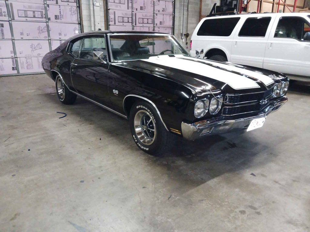 Classic black car with white racing stripe
