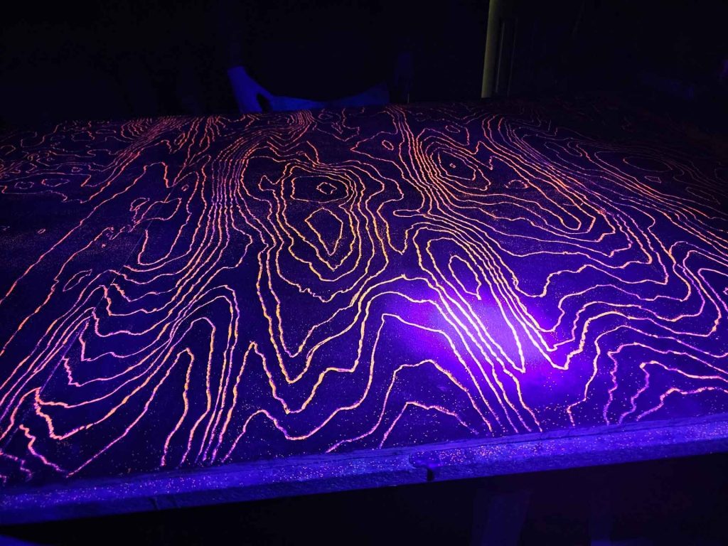 Speaker with glow in the dark wood grain texture