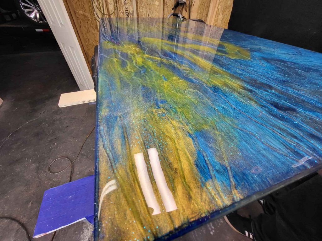 Wood with blue and yellow marbled paint job